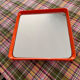 Orange moulded plastic mirror