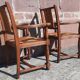 Pair of oak armchairs with straw seats and backs.