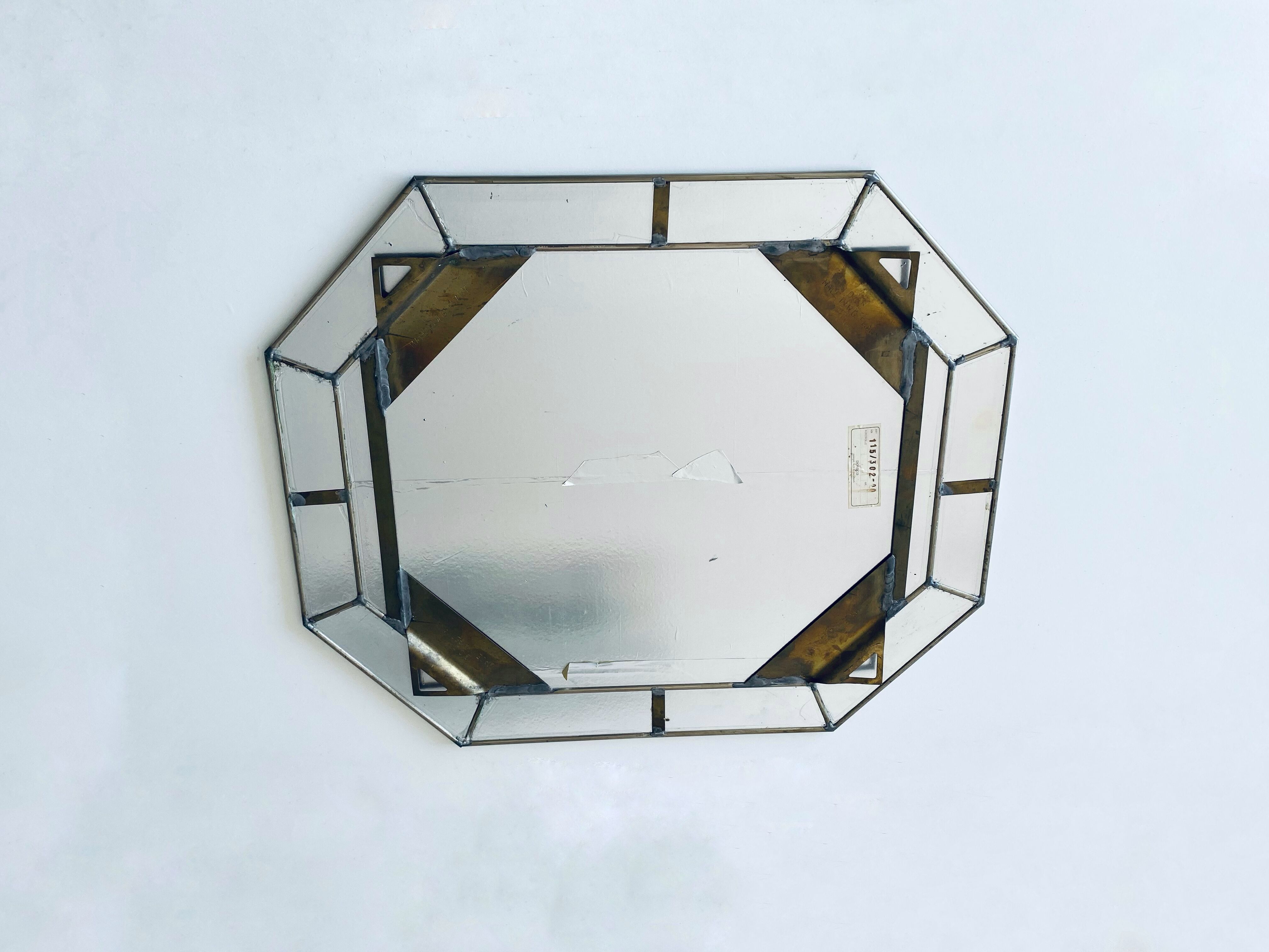 Old octagonal beveled mirror with parcloses