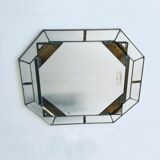 Old octagonal beveled mirror with parcloses