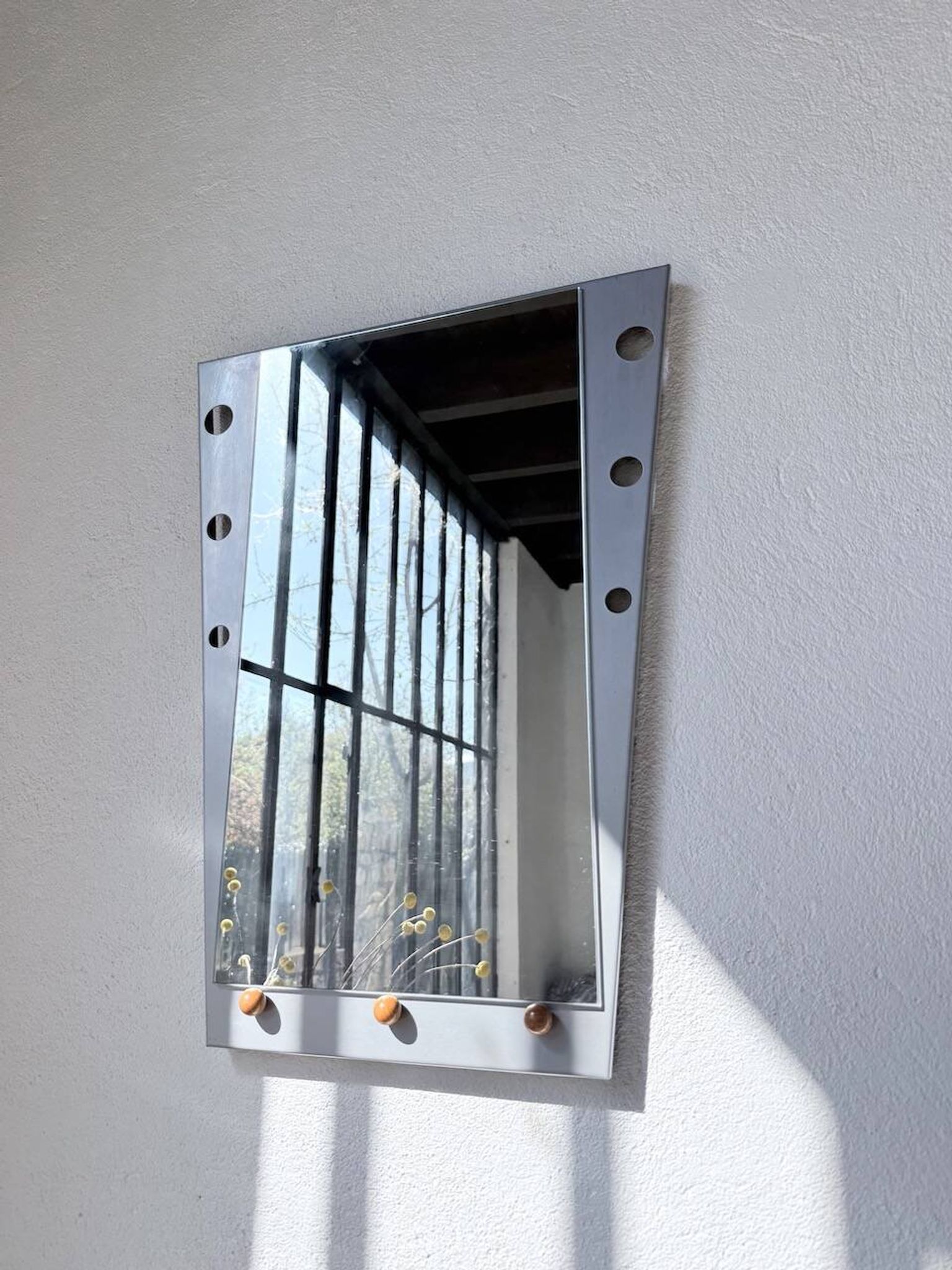 Pair of "Memphis" mirrors from the 80s in chrome and wood.