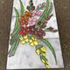 Vintage rectangular coffee table with ceramic inlaid flowers and steel.