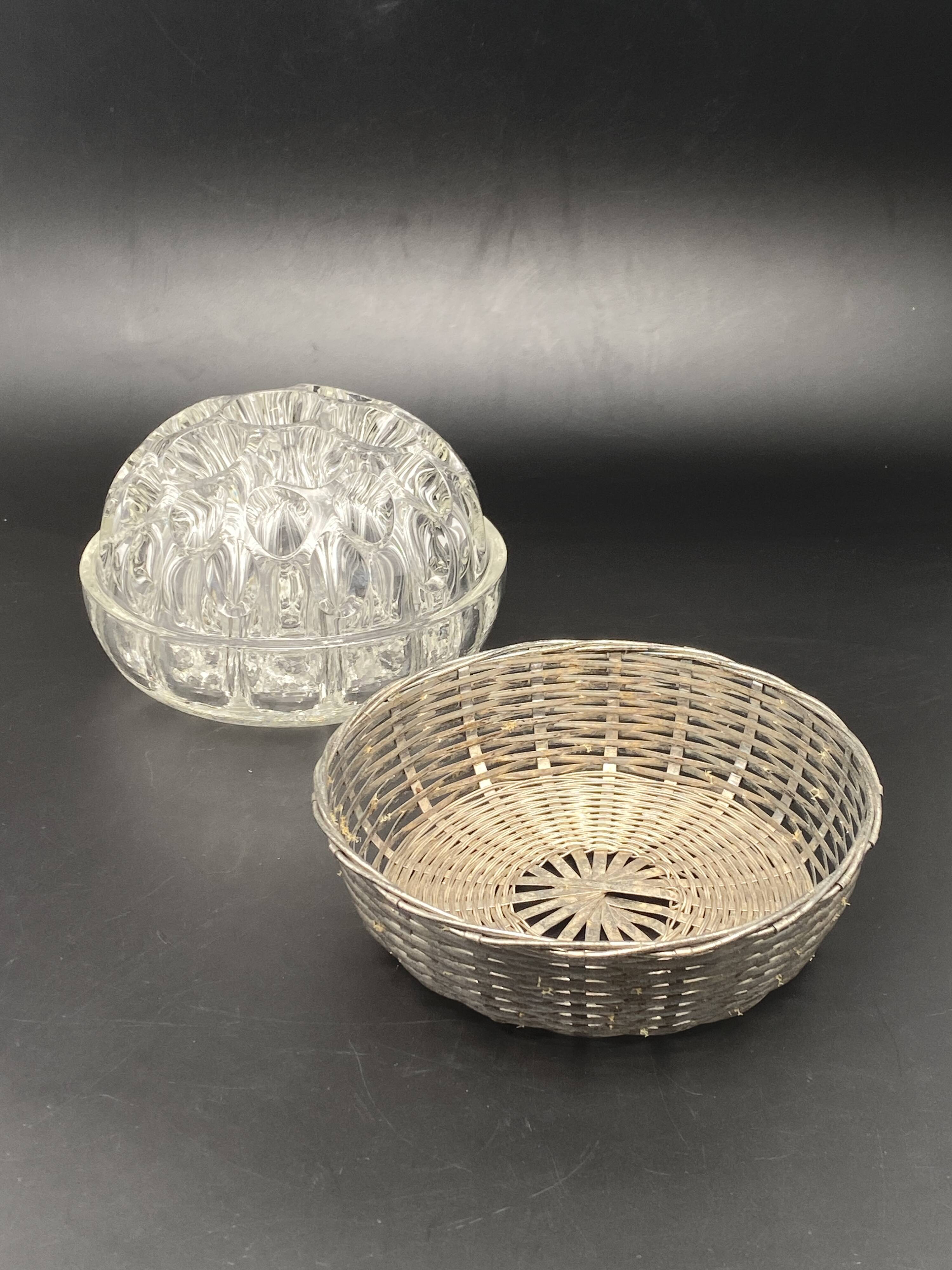 Glass flower stand with woven metal support