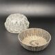 Glass flower stand with woven metal support