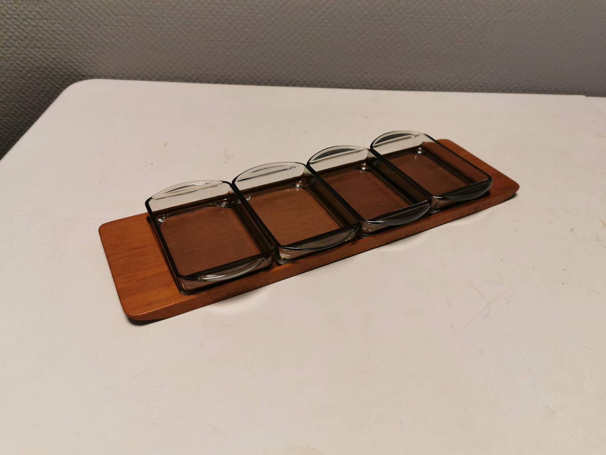 Teak Cabaret tray with four smoke coloured glass bowls, Danish and produced by Wiggers 1970s.
