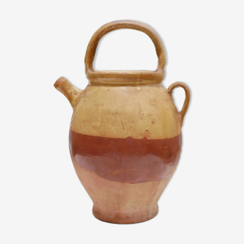 Old gargoulette pot in glazed terracotta