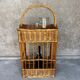 Vintage wicker bottle rack