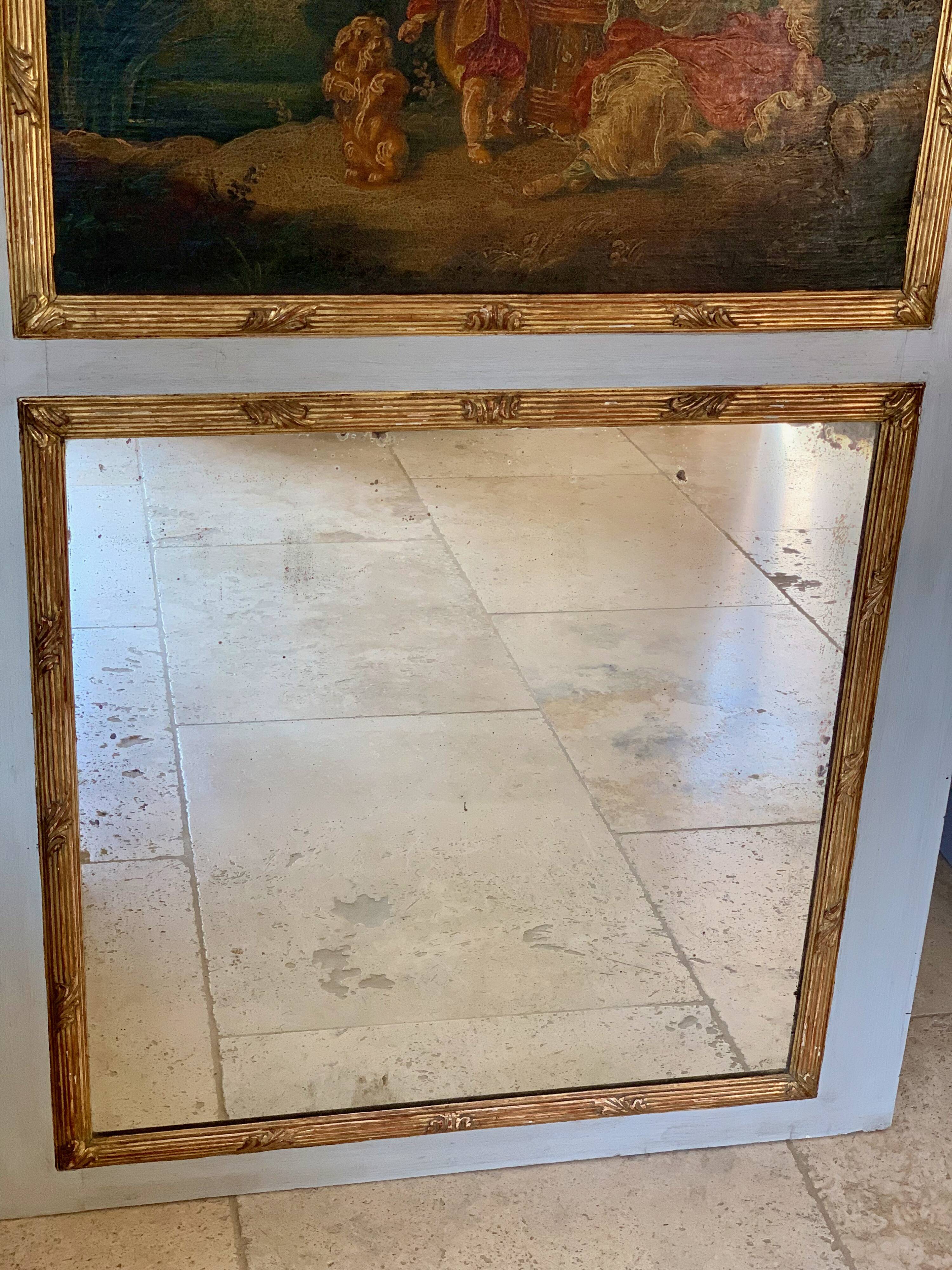 TRUMEAU Louis XVI, Large Model, in gilded wood from the 19th century