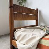 Brutalist style bed with chain and straw
