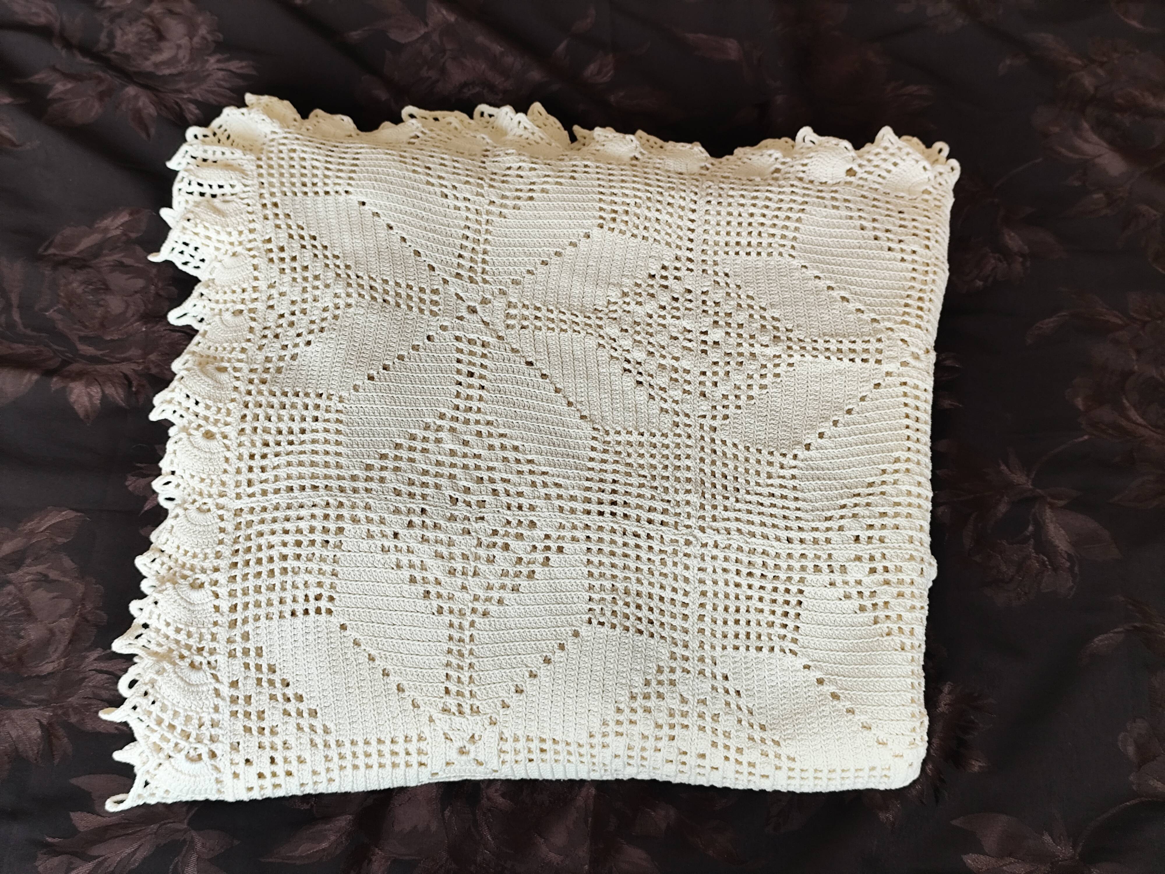 White cotton bedspread, crocheted sofa throw with star patterns