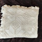 White cotton bedspread, crocheted sofa throw with star patterns