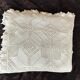 White cotton bedspread, crocheted sofa throw with star patterns