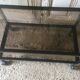 Metal coffee table with smoked glass.