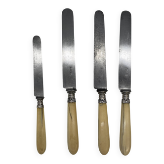 Set of 3 lunch knives and 1 dessert knife with ivory handle.