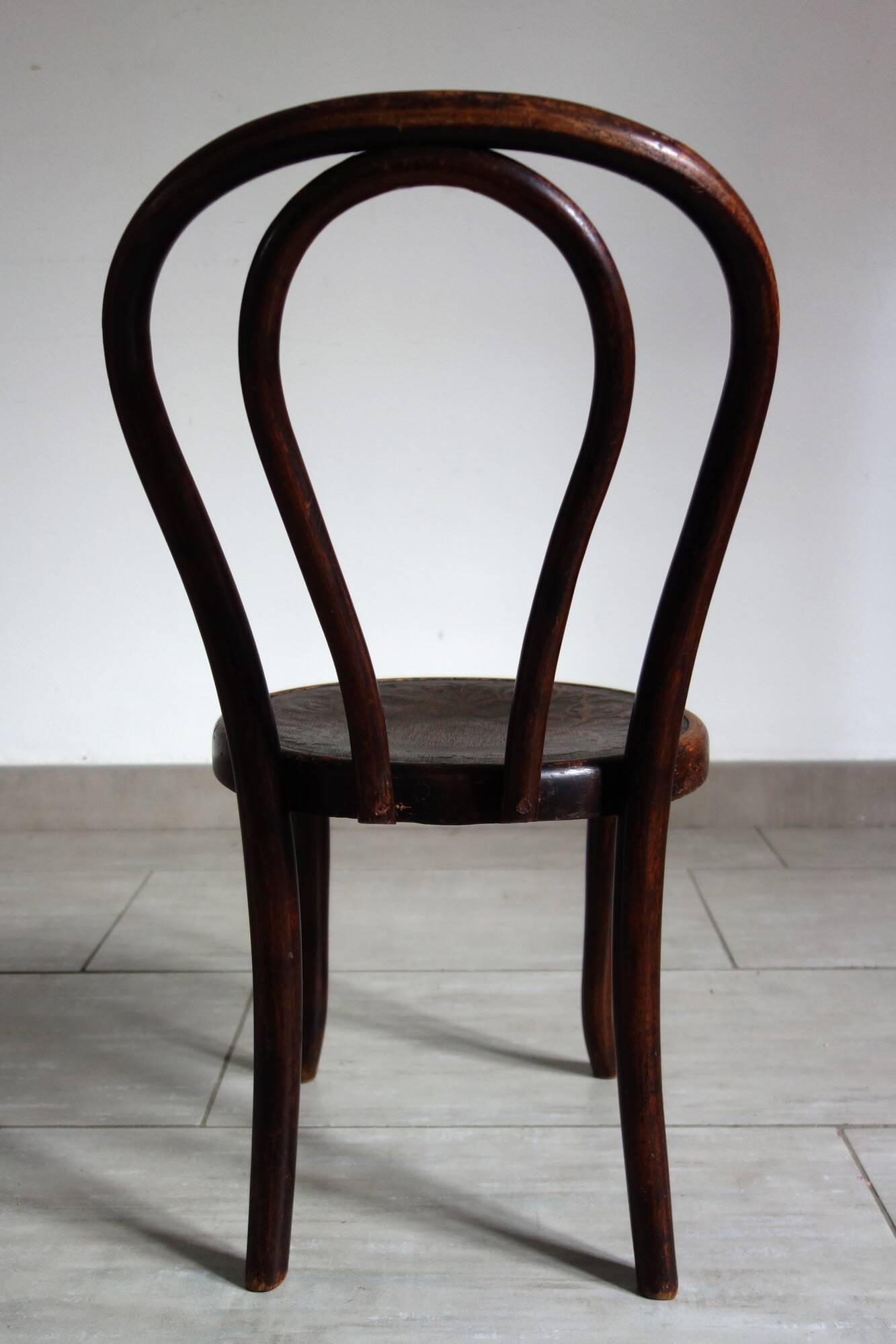 Antique curved wooden children's chair by Fischel, early 20th century.