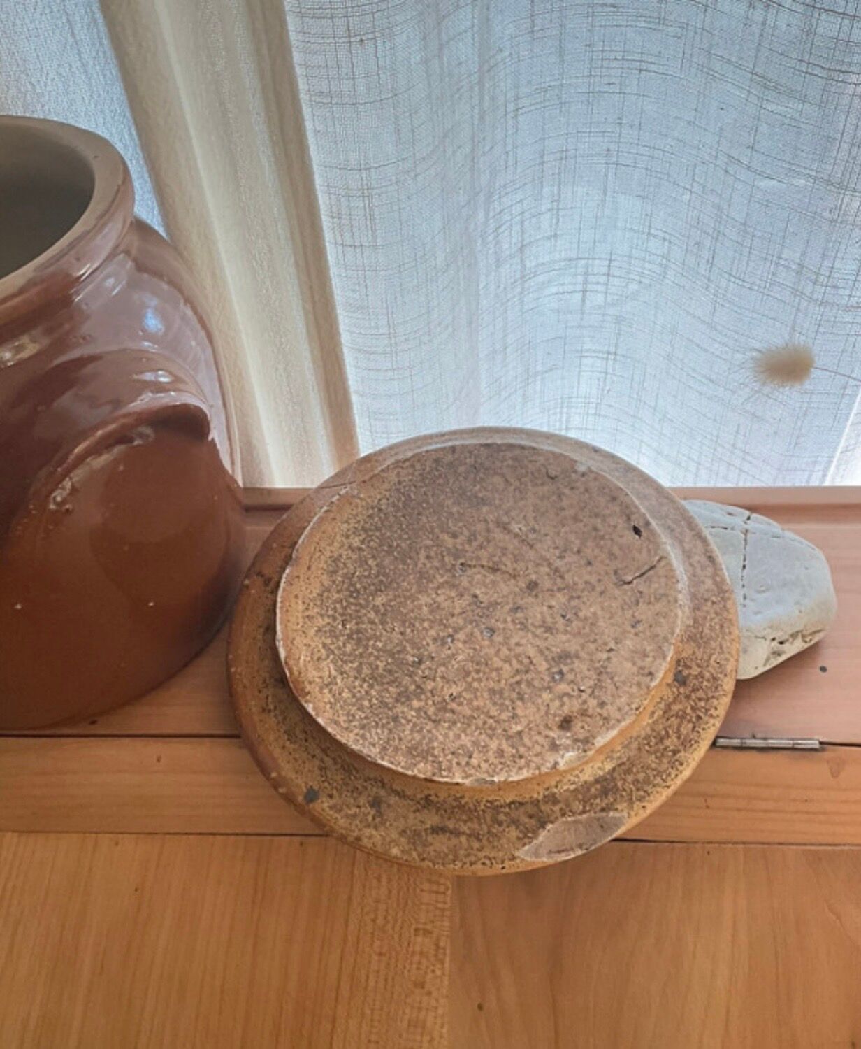Ancient ceramic salt cellar and its lid.