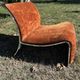 Chrome steel armchair and orange fabric by Vittorio Introini
