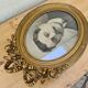 Antique medallion frame in gilded stucco with its period portrait.