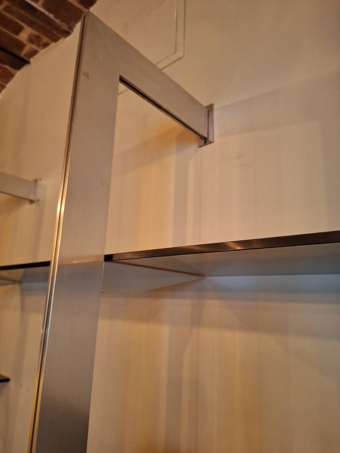 Wall shelves in wood, stainless steel and glass Roche Bobois