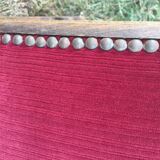 50s footrest in red velvet and scuplented wood
