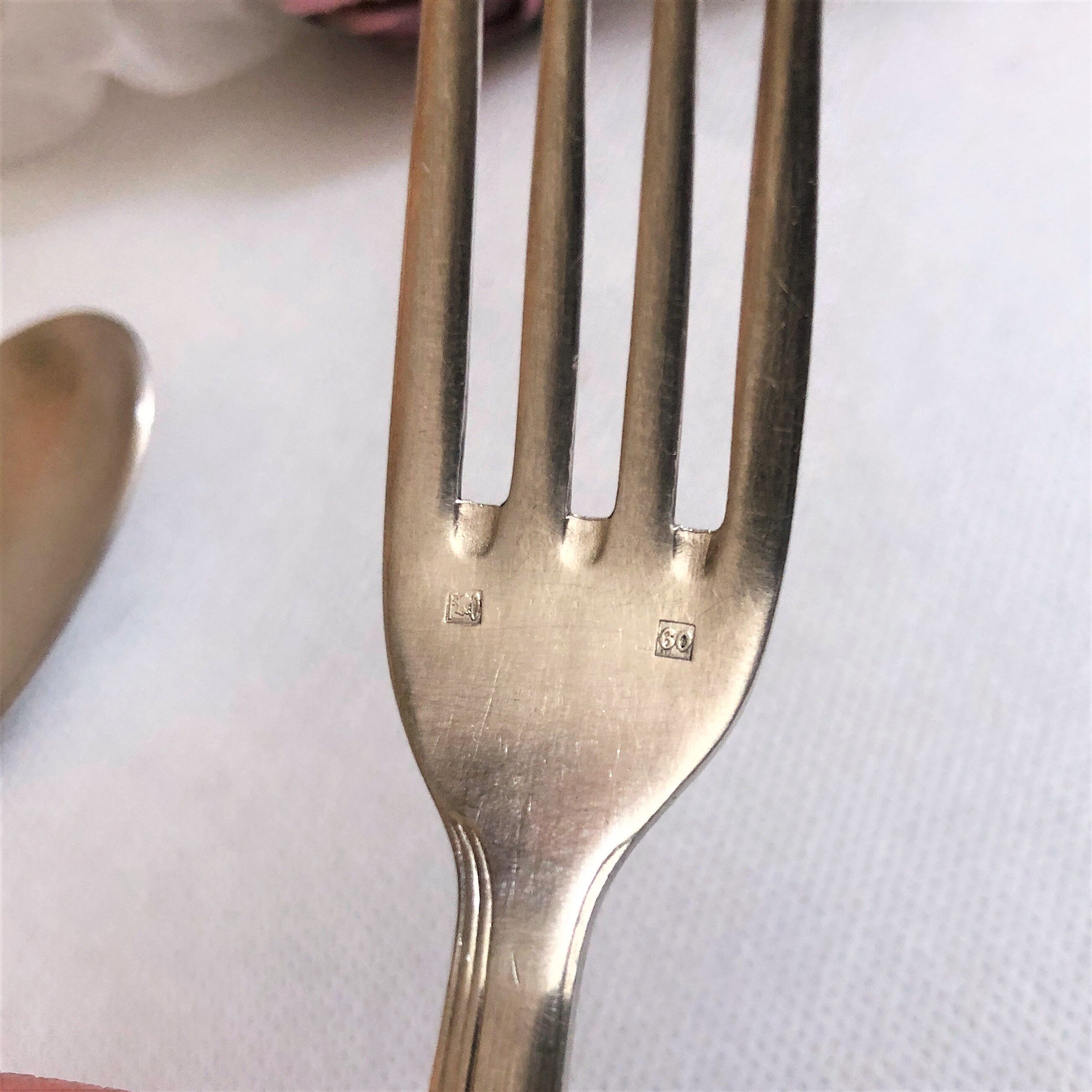 Set of 2 silver metal cutlery with punches