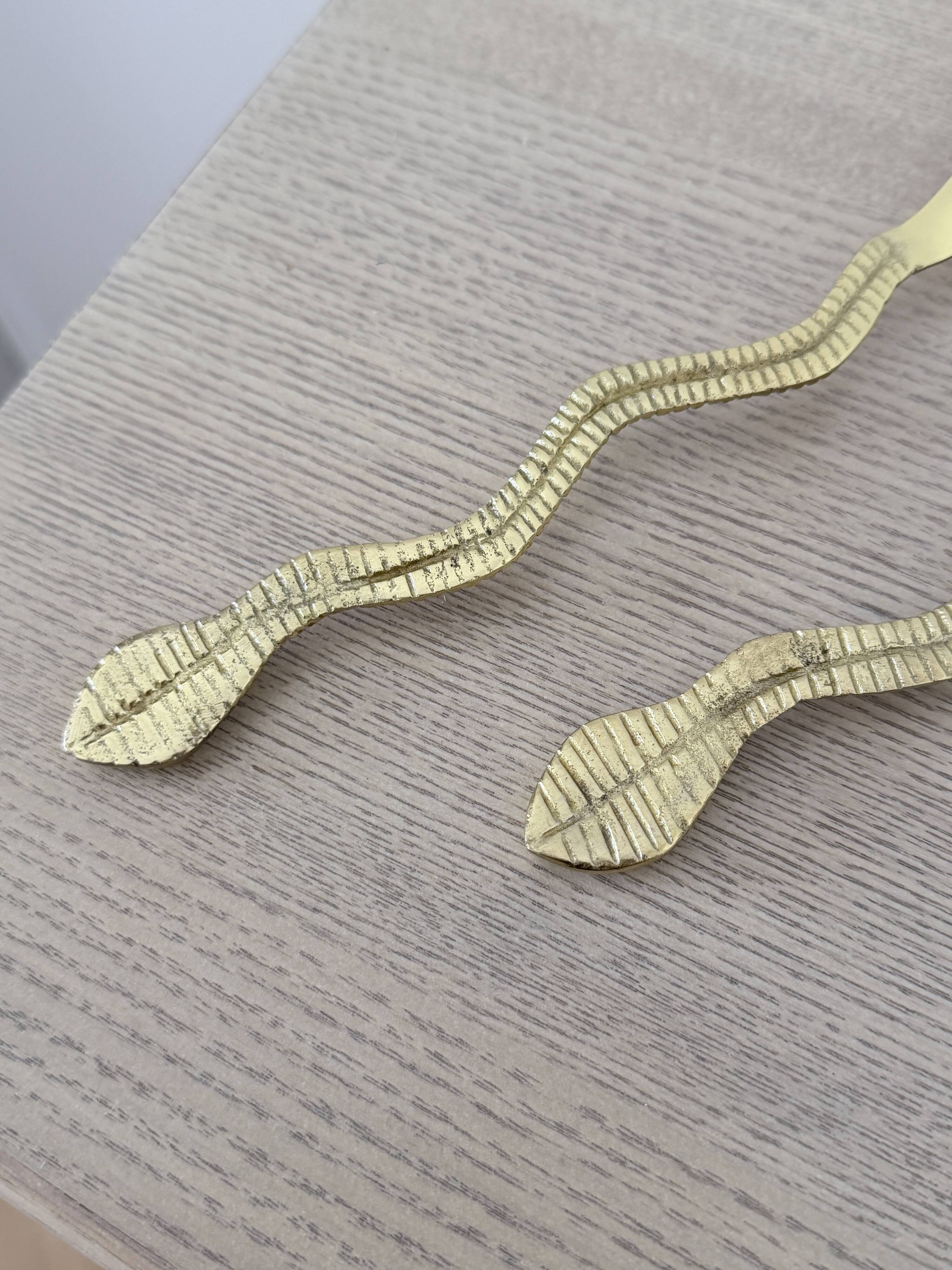 Gold metal snake salad serving set