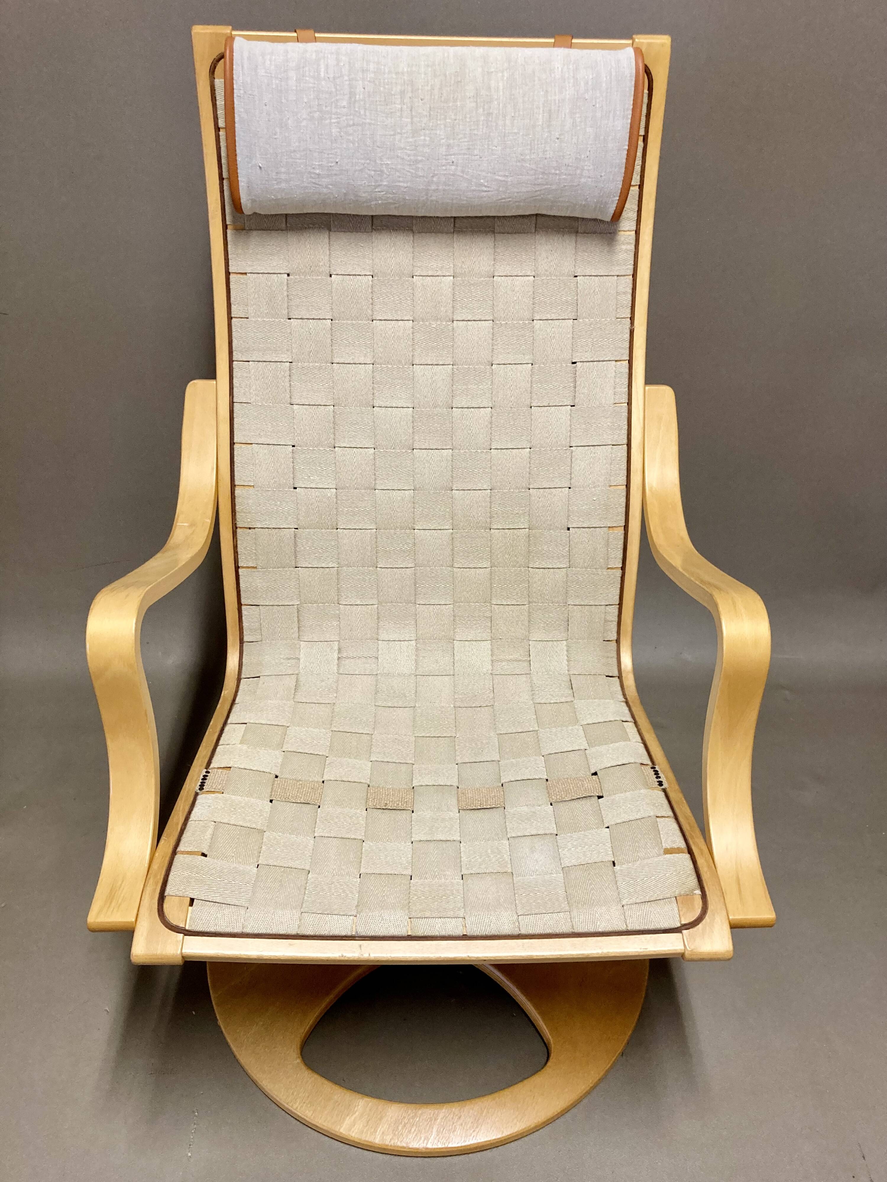 Scandinavian design swivel armchair and ottoman