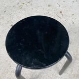 Black curved wooden stool
