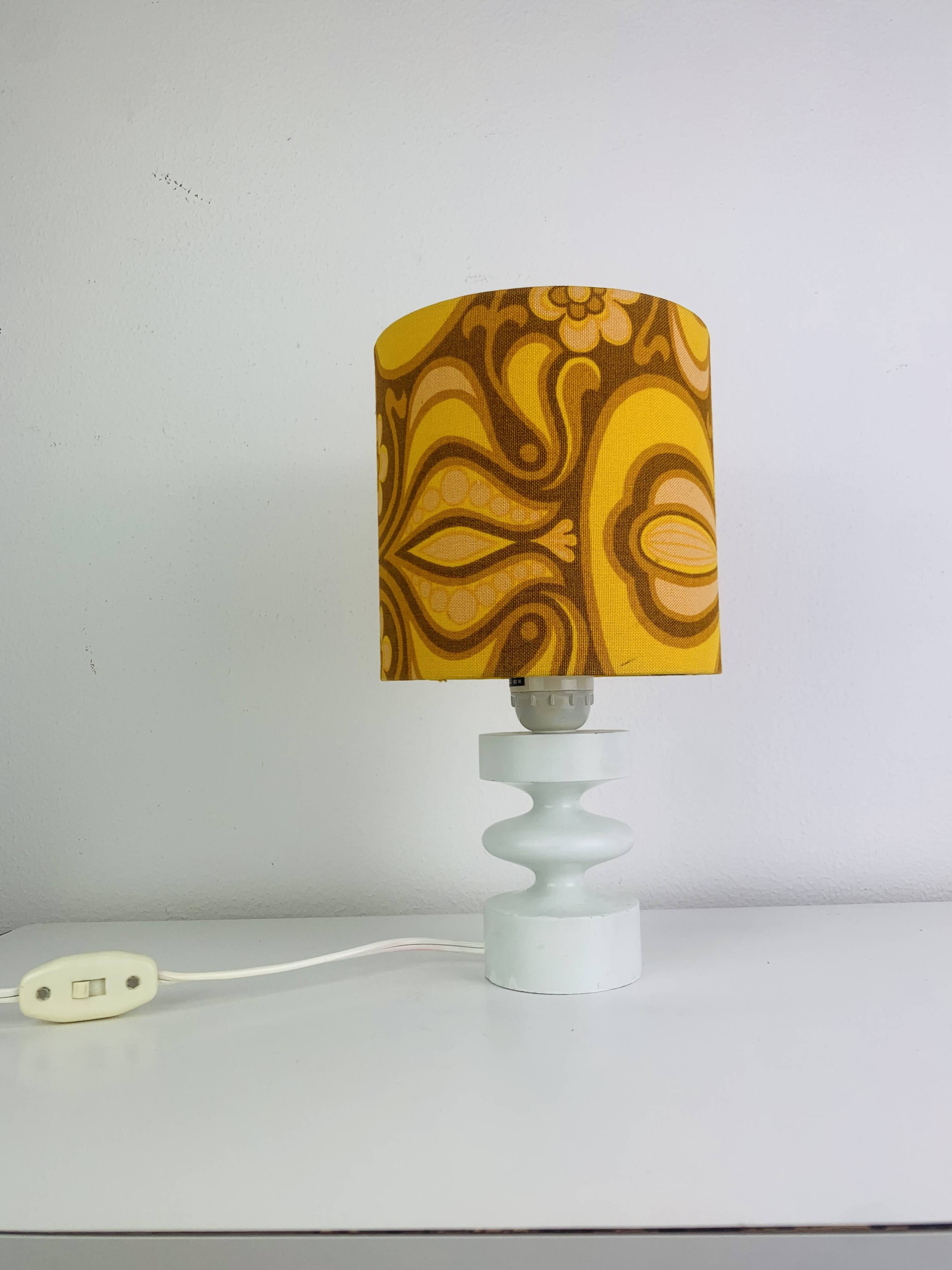 Temde lamp with turned wood and a seventies lampshade.
