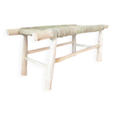 Natural wood bench and braided doum.