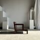 Small low armchair in varnished brown wood