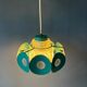Suspension Space Age with glass shade and green/blue metal structure.