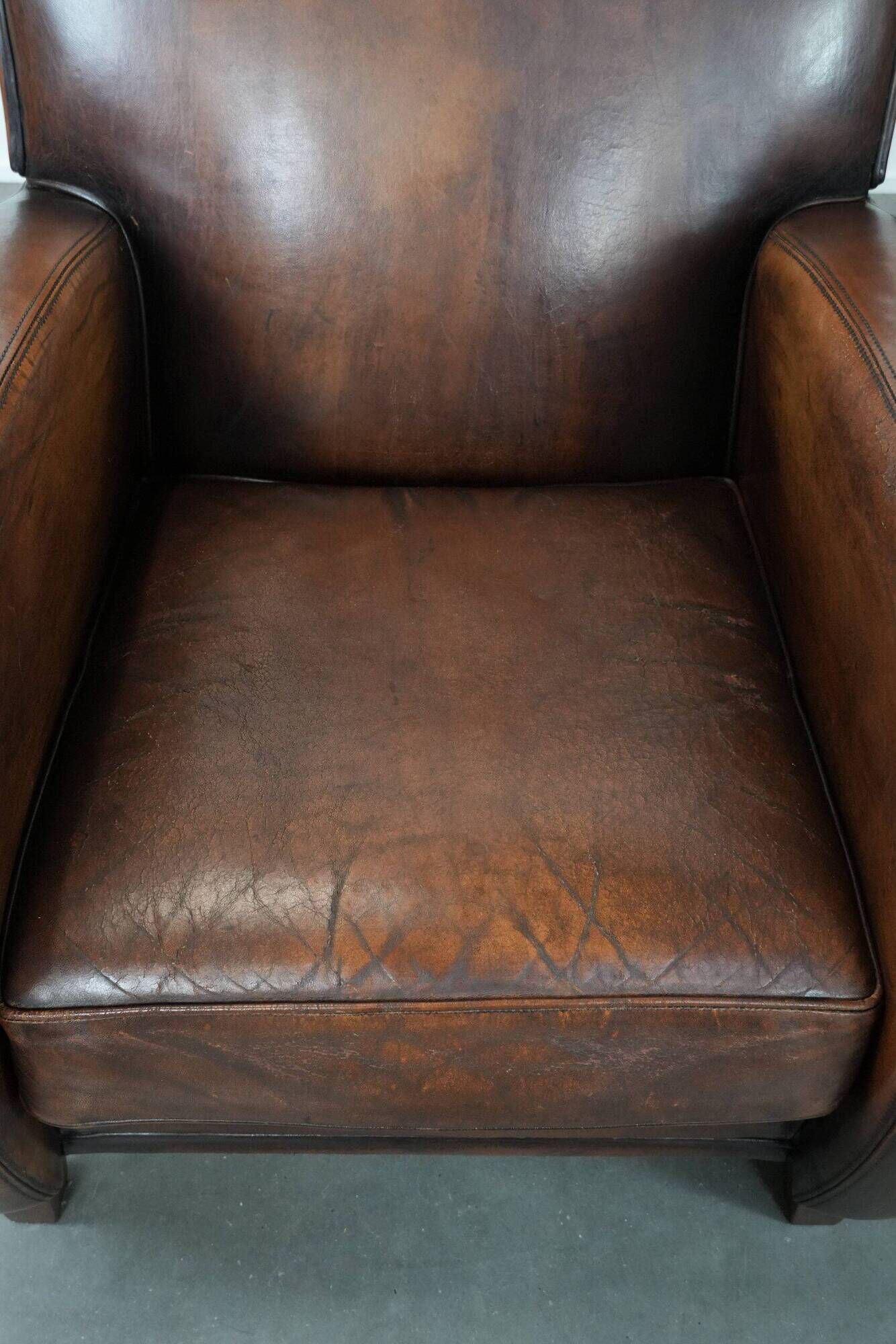 Characterful set of two vintage sheepskin armchairs with beautiful colours
