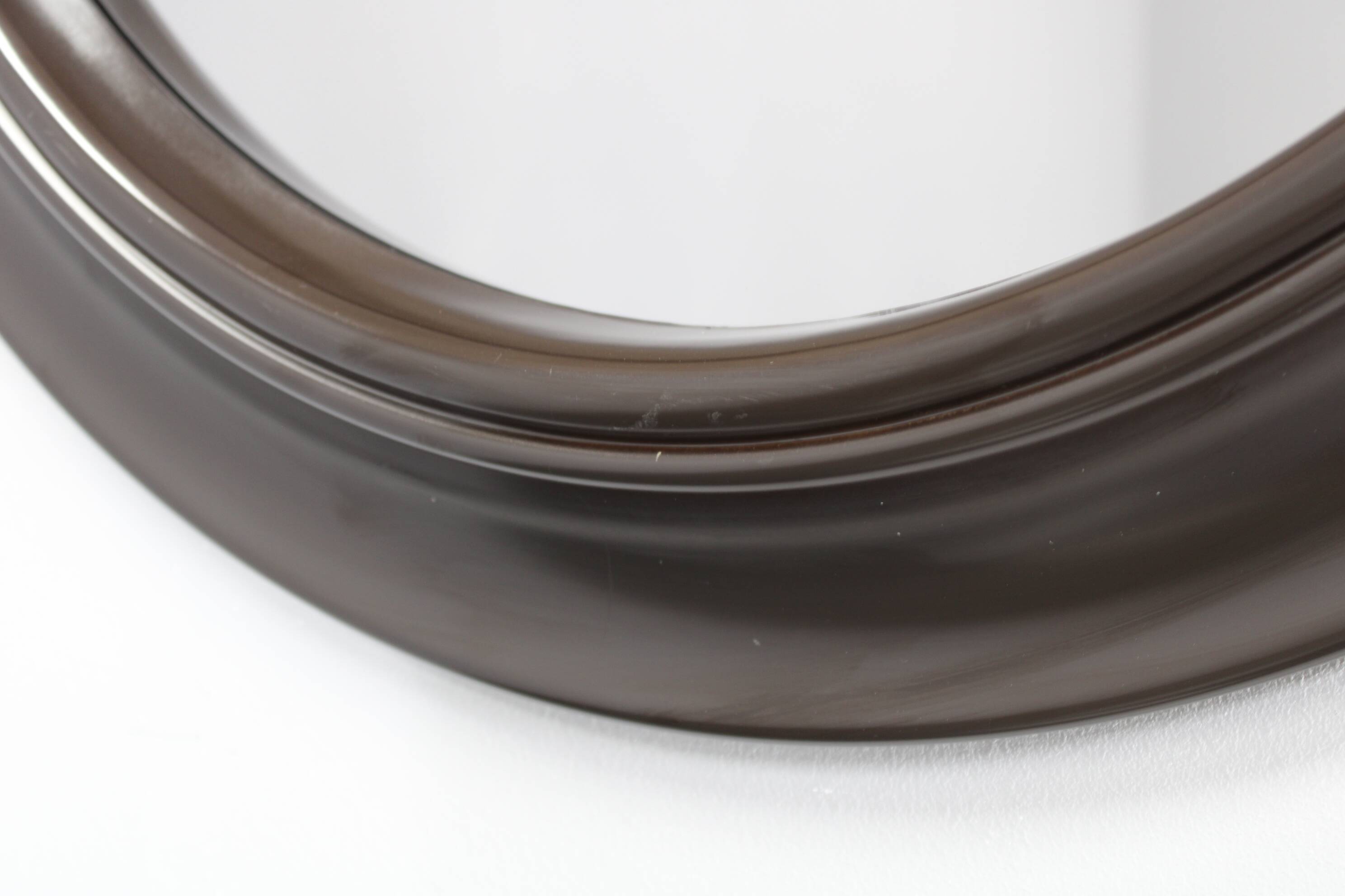 1970s Italian round mirror in dark brown plastic frame