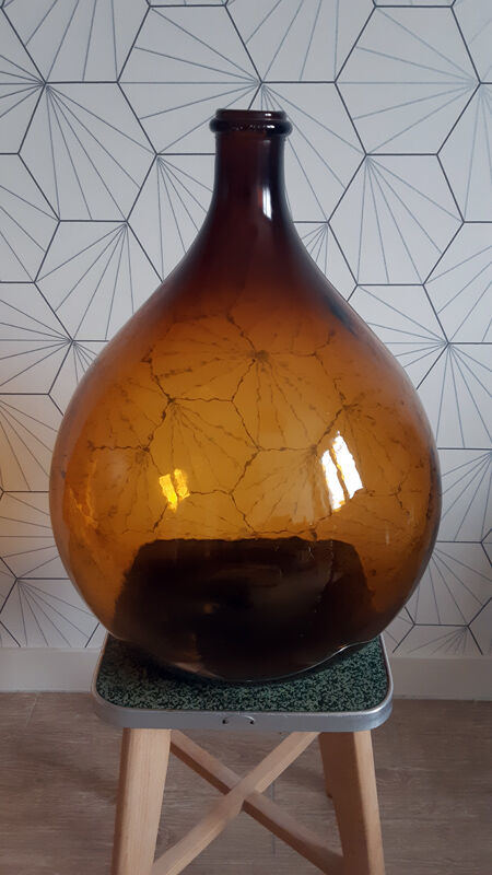 Great old demijohn in amber glass