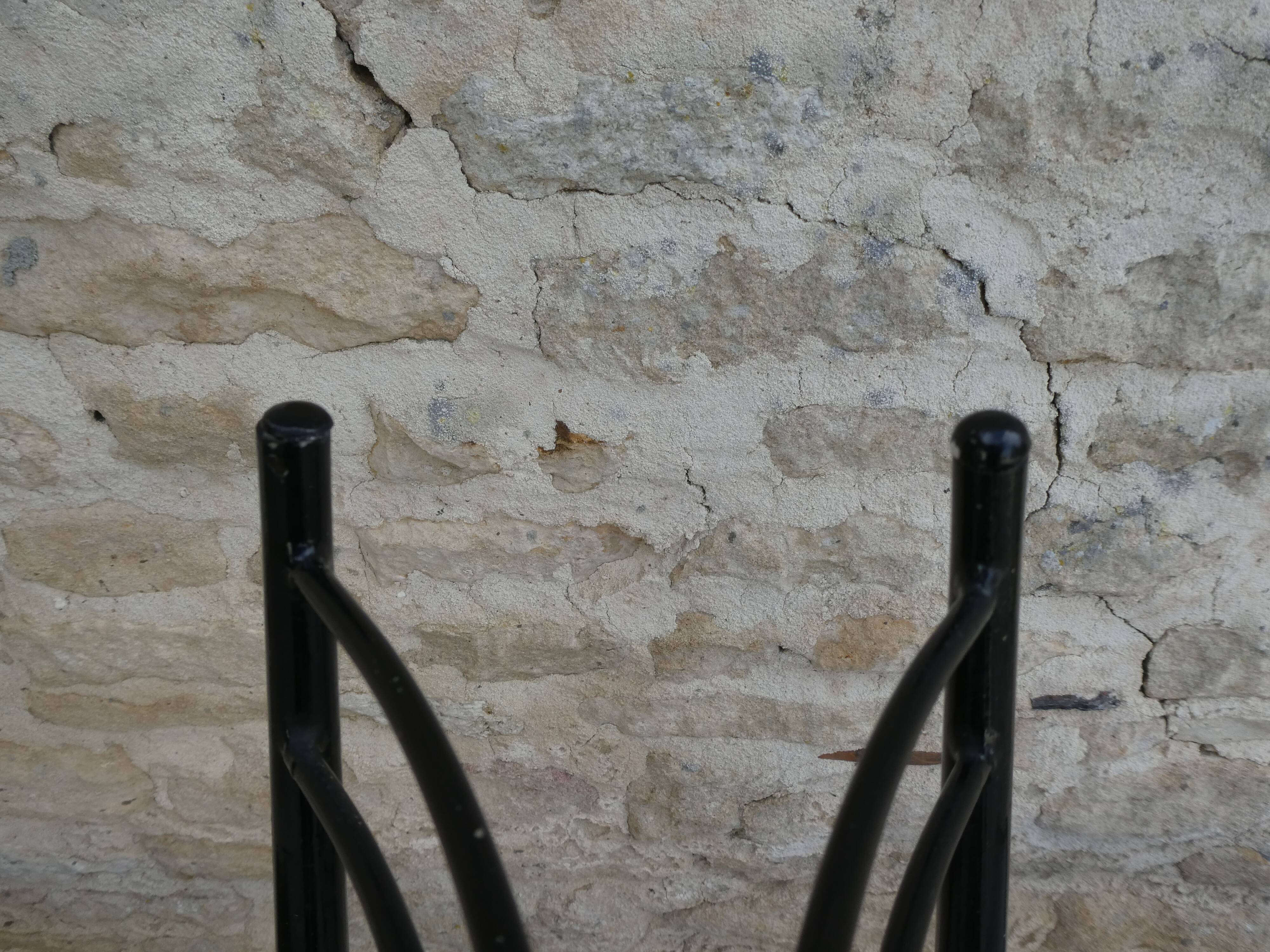 Pair of black metal chairs and khaki green skai, 60s