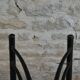Pair of black metal chairs and khaki green skai, 60s