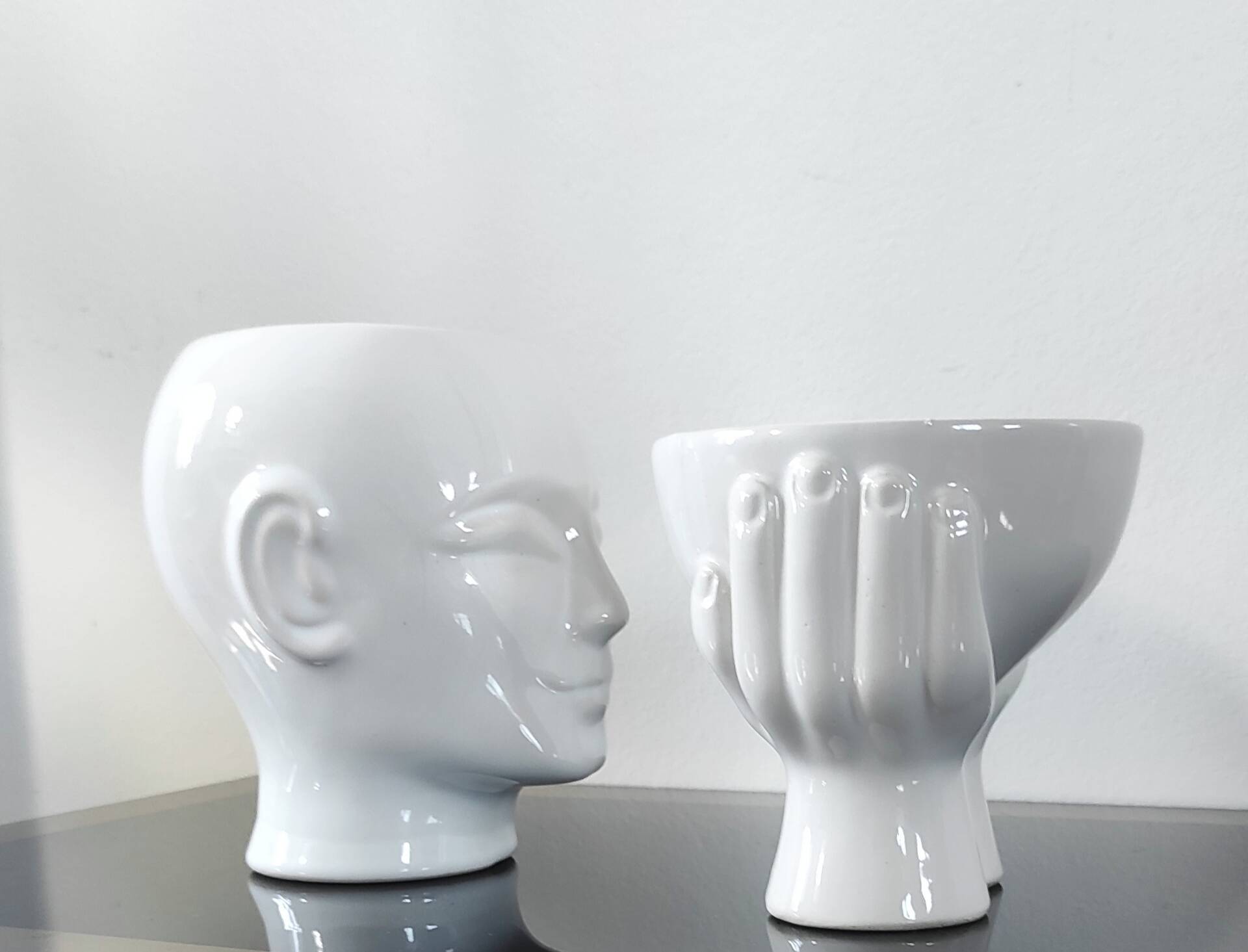 A pair of vintage ceramic plant pots.