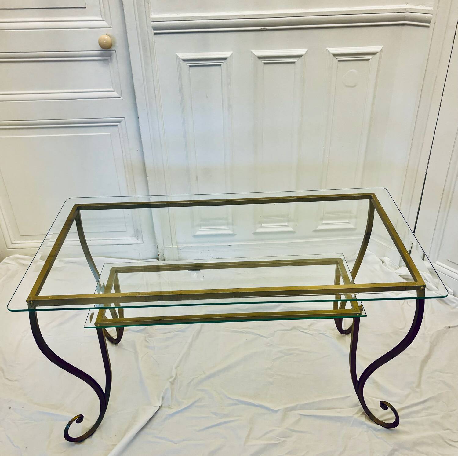 Large gold wrought iron and glass side table.