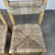 2 straw and wood chairs in brutalist style