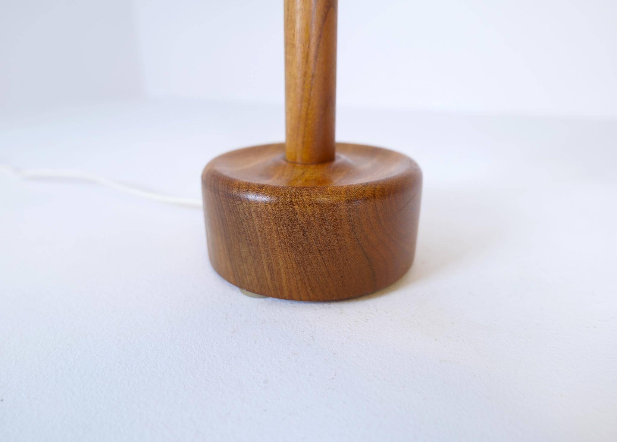 Mid-century solid teak table lamp from the 1960s Sweden.