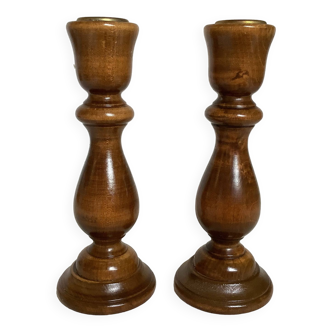 Pair of varnished wooden candlesticks