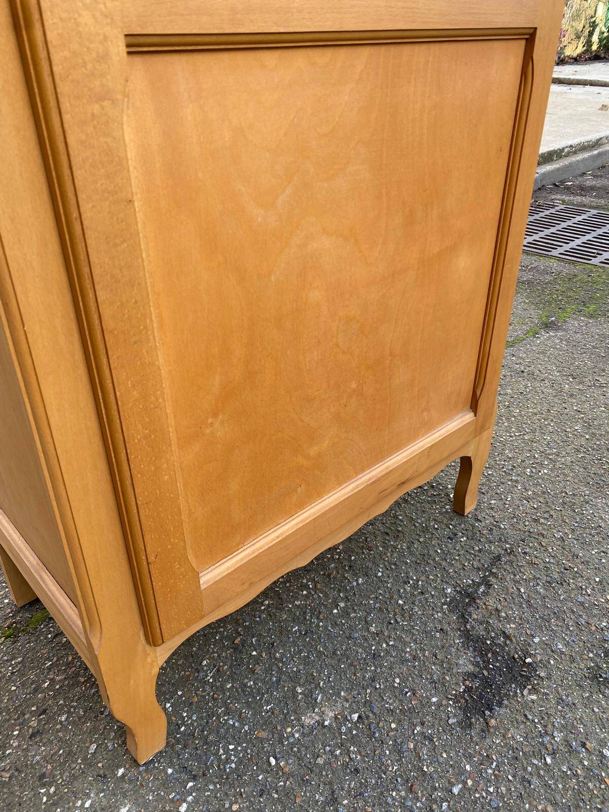 Parisian glass-fronted wardrobe in light wood from the 1960s.