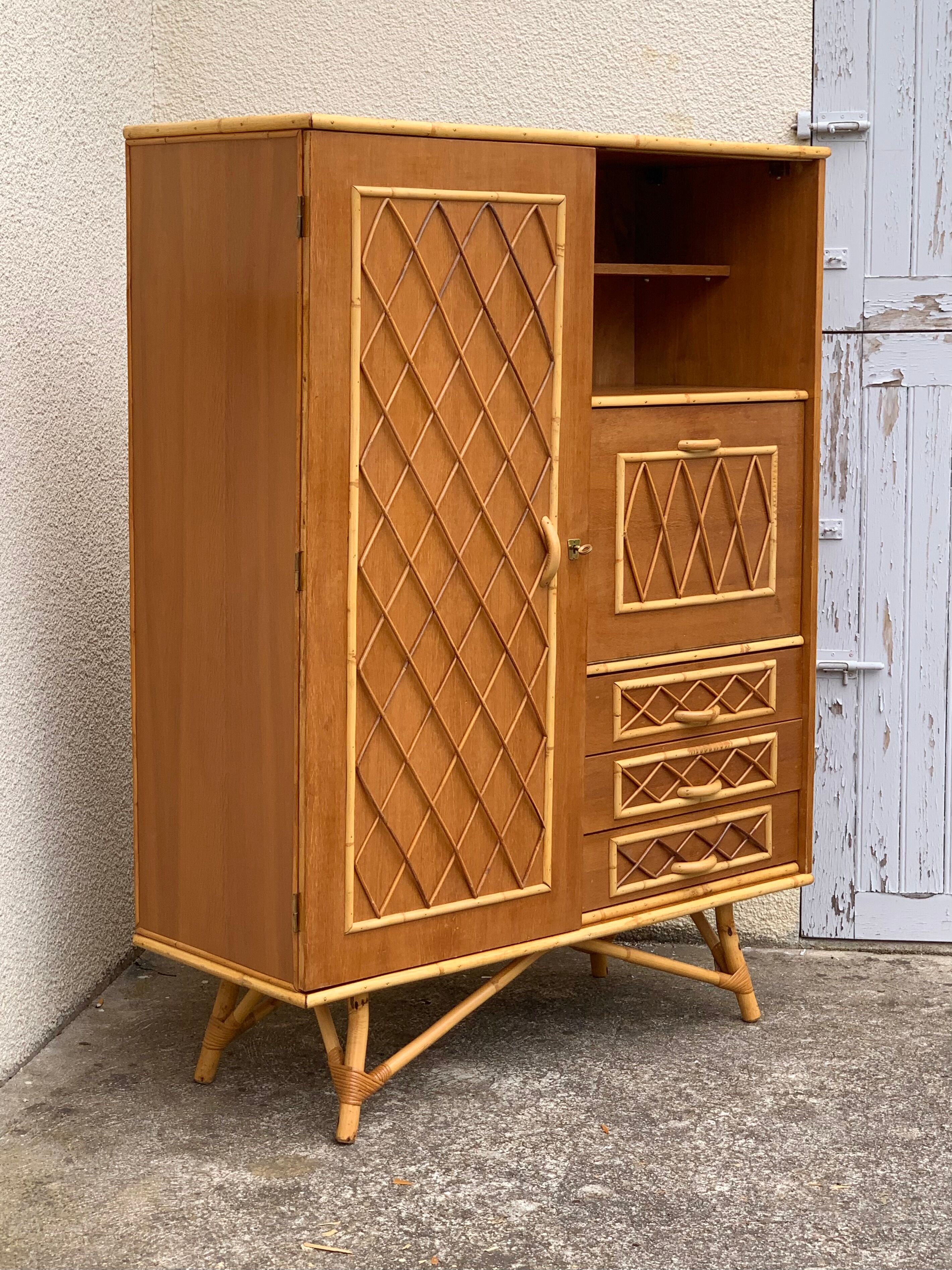 Rattan wardrobe with tapered legs from the 1960s.