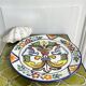 Decorative ceramic plate with griffins