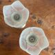 Pair of tulip-shaped candle holders in frosted glass and brass.