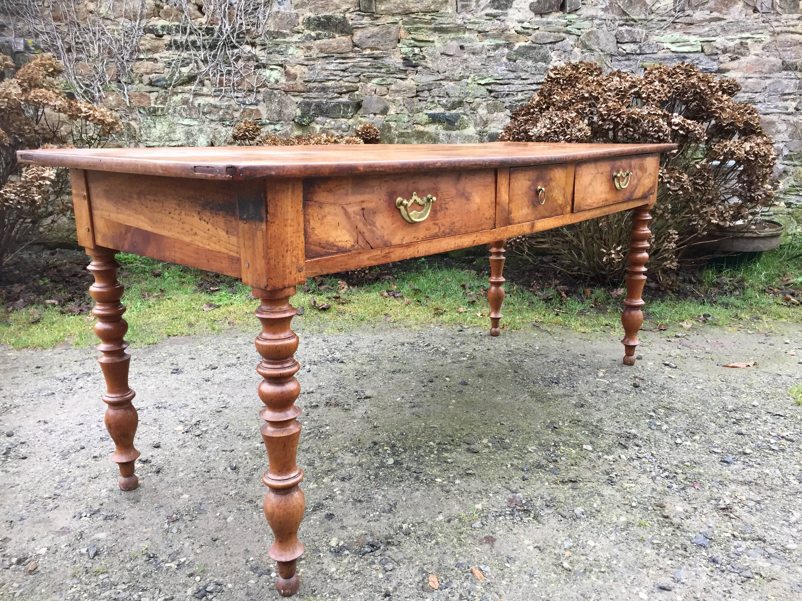 Old cherry farmhouse table with 3 drawers and turned legs