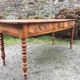 Old cherry farmhouse table with 3 drawers and turned legs