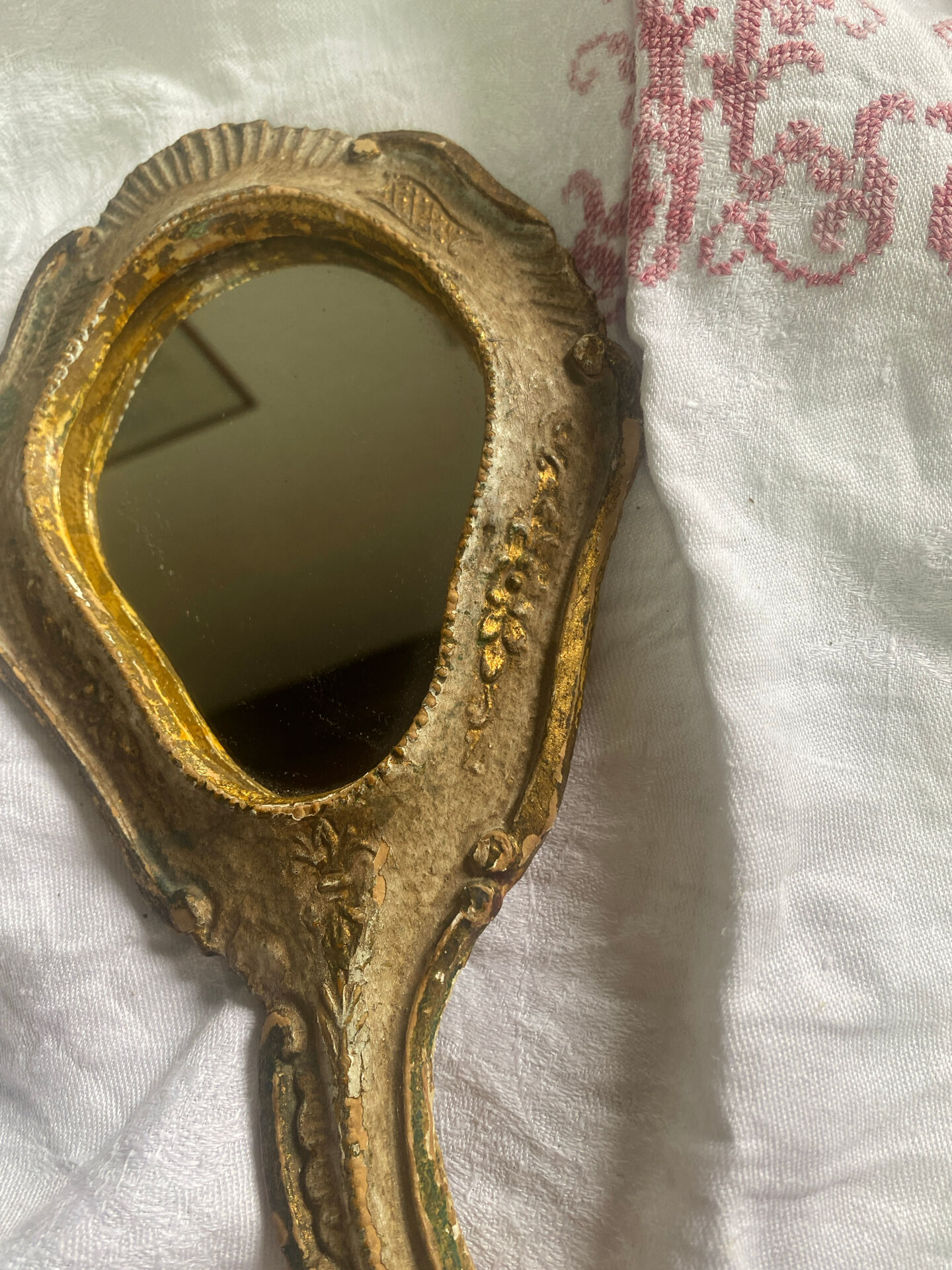 Patinated wooden Florentine hand mirror