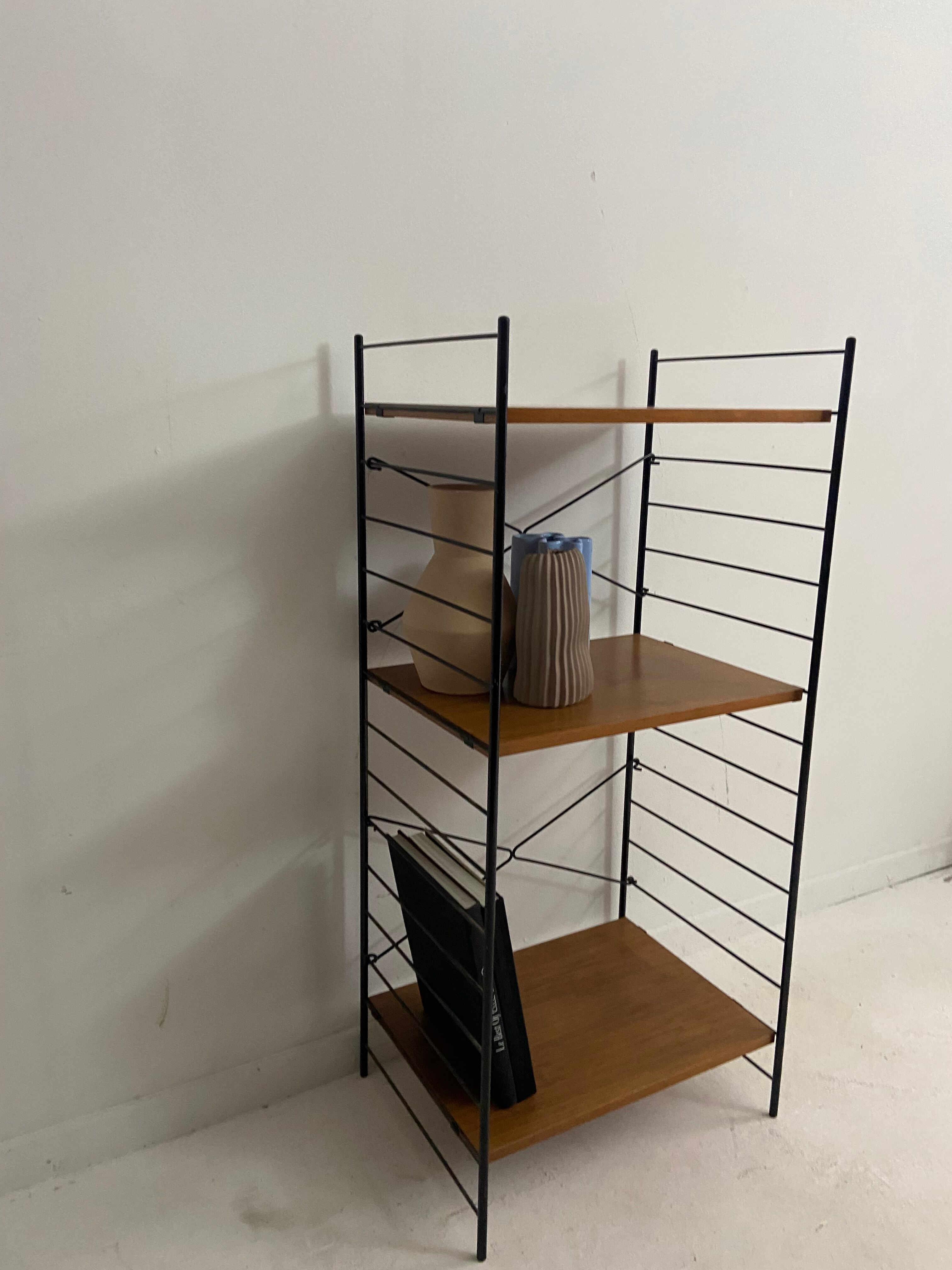 small vintage metal and teak string bookshelf